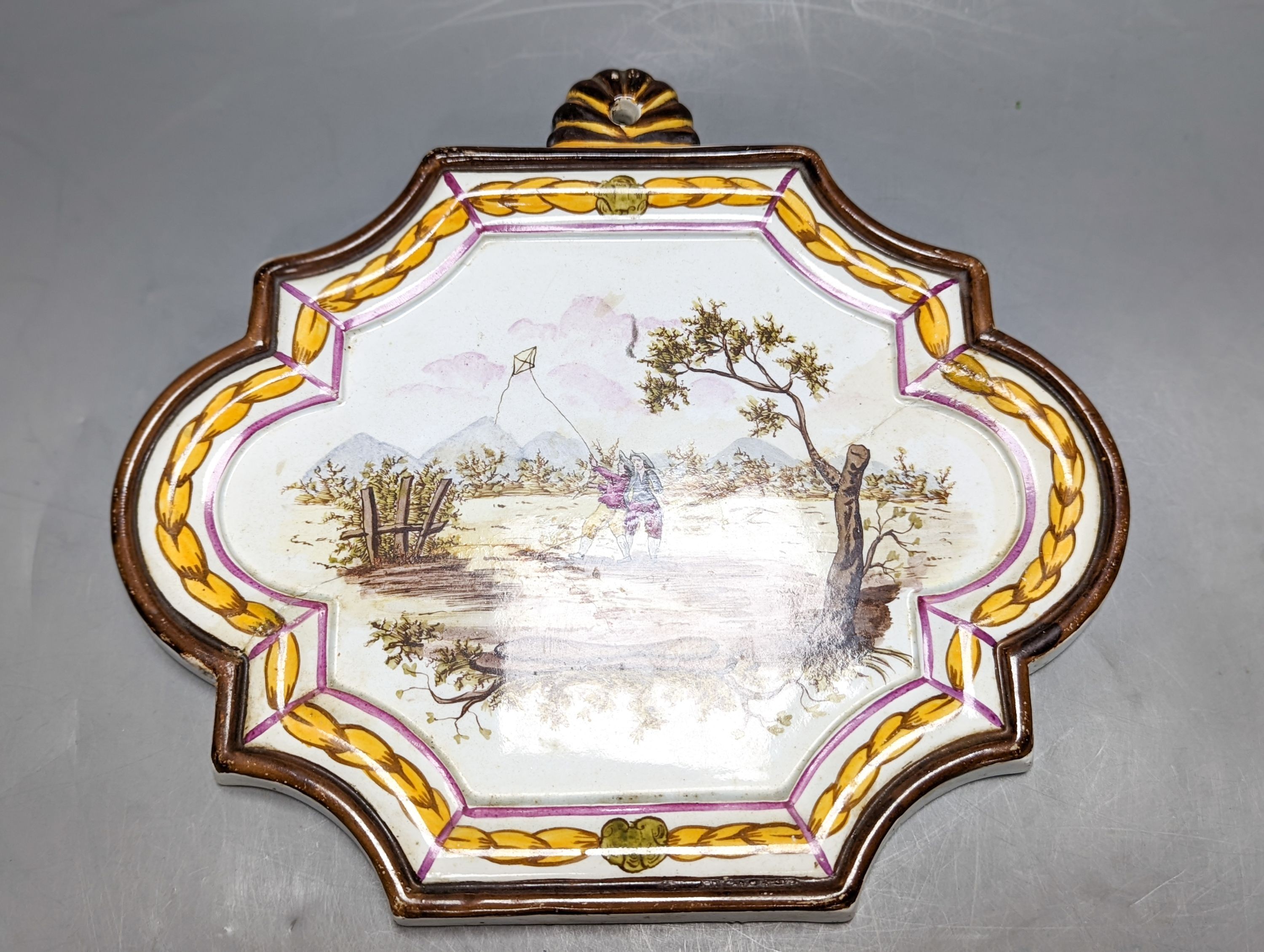 A pair of 19th century painted faience plaques in the style of Veuve Perrin 23cm